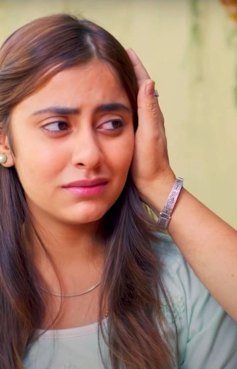 A woman reacts in a Vyapar community campaign